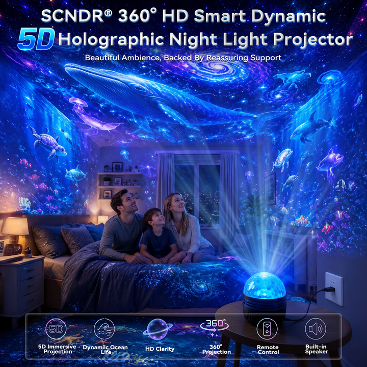 Gezin op bed in een kamer vol projecties van walvissen, schildpadden en dolfijnen, met de projector aan een stopcontact op een tafeltje. 10