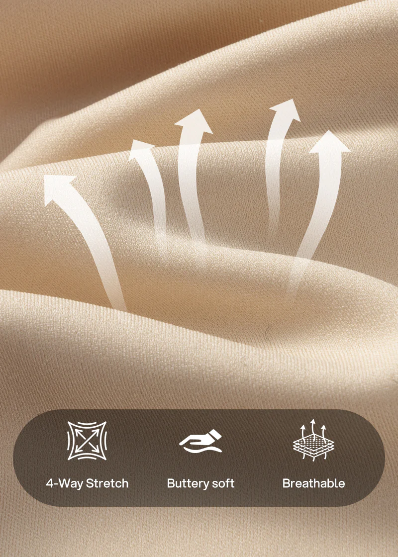 Close-up van de zachte beige stof met pijlen en pictogrammen voor vierweg rek, zachte aanraking en ademend materiaal. 18