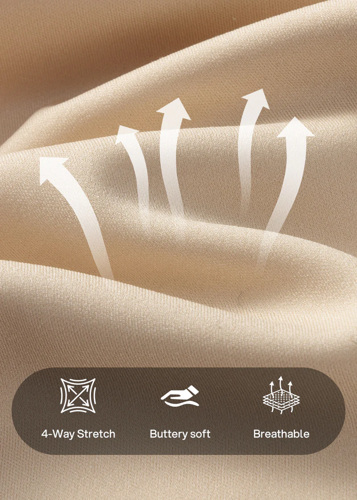Close-up van de zachte beige stof met pijlen en pictogrammen voor vierweg rek, zachte aanraking en ademend materiaal. 18