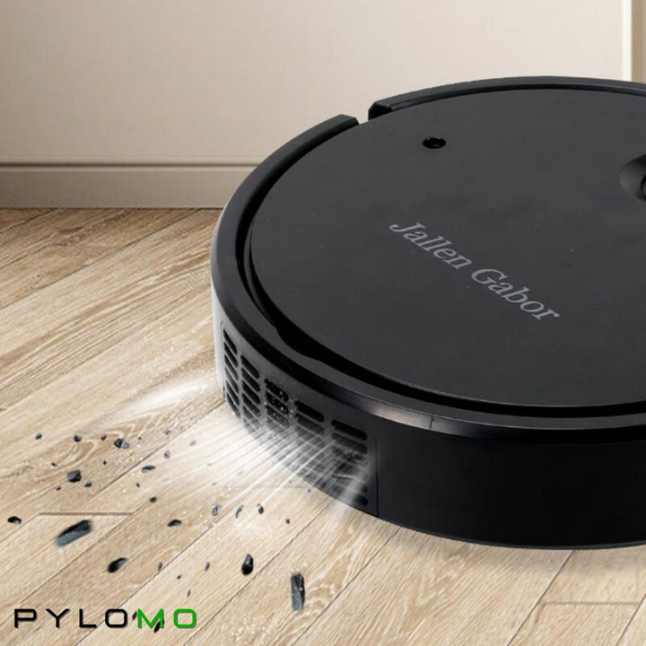 Zwarte robotstofzuiger op een parketvloer die opgezogen vuildeeltjes en stof bij de luchtopeningen laat zien. 5