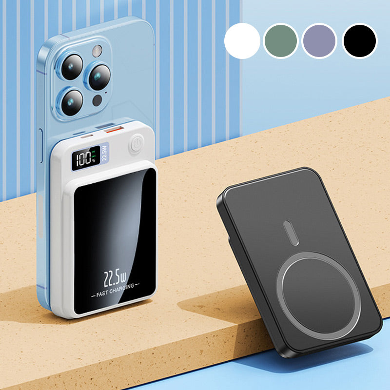 Witte powerbank magnetisch bevestigd aan de achterkant van een blauwe smartphone, naast een zwarte powerbank en vier kleurenstalen. 5