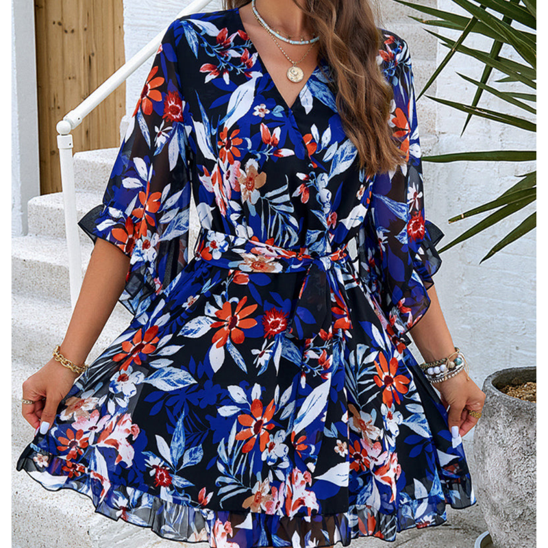 Speelse mini jurk met bloemenpatroon en klokmouwen - Liora