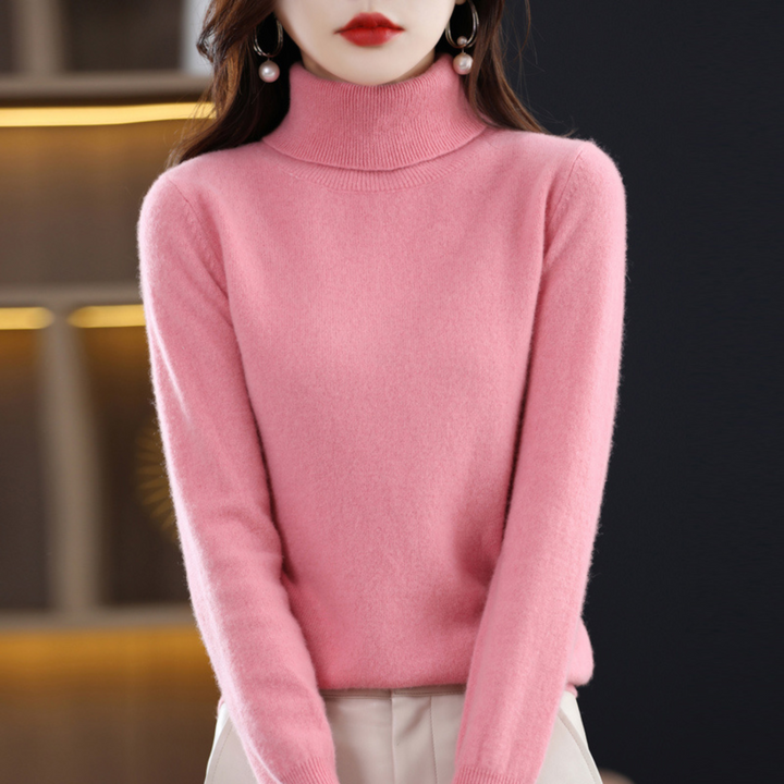 Roze coltrui met zachte vezels, gedragen door een model dat staat met de handen langs het lichaam. 7