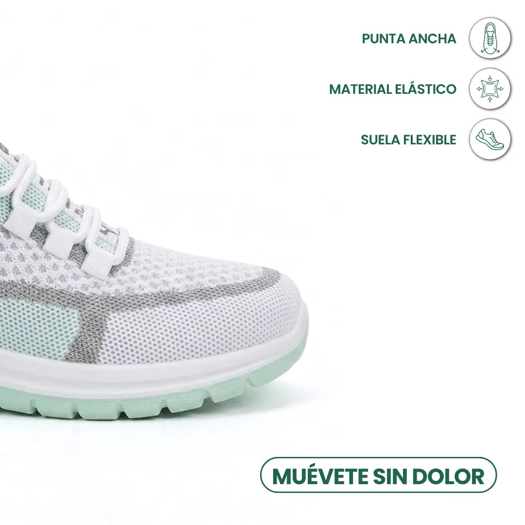Detail van de brede neus van de witte mesh sneaker met mintgroene zool en pictogrammen voor elastisch materiaal en flexibele zool. 14