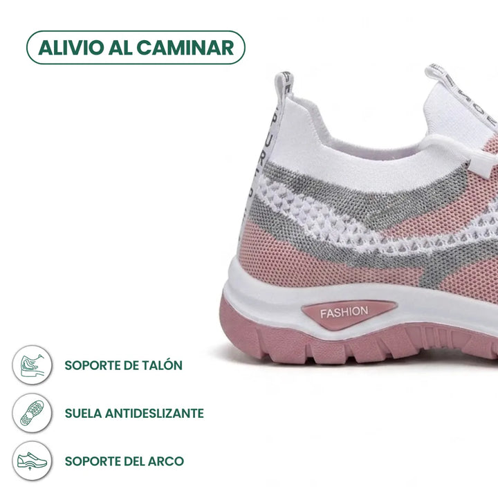 Achterkant en hielpartij van de sneaker in wit, grijs en roze mesh met roze antislipzool, met kenmerken van hiel- en boogondersteuning. 22
