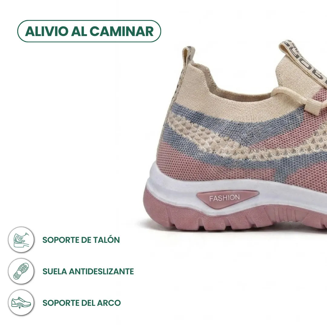 Achterkant van de beige sneaker met roze en blauwgrijze mesh en roze antislipzool, met iconen voor hiel- en boogondersteuning. 31