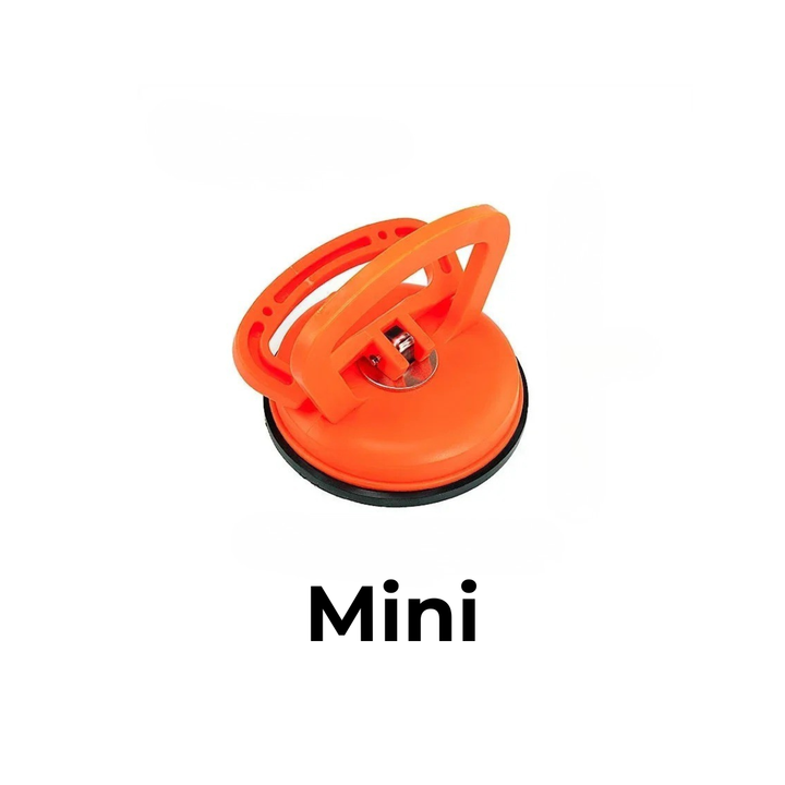 Kleine oranje zuignap met handgreep en zwarte rubberen rand, de mini-uitvoering op een witte achtergrond. 6