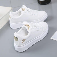 Trendy women's faux leather sneakers with metallic accents - Norell