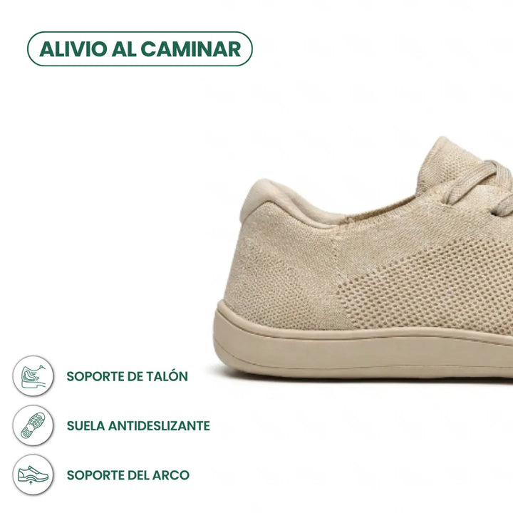 Detail van de hiel van de beige sneaker met pictogrammen voor hielondersteuning, antislipzool en booggewelfsteun. 4