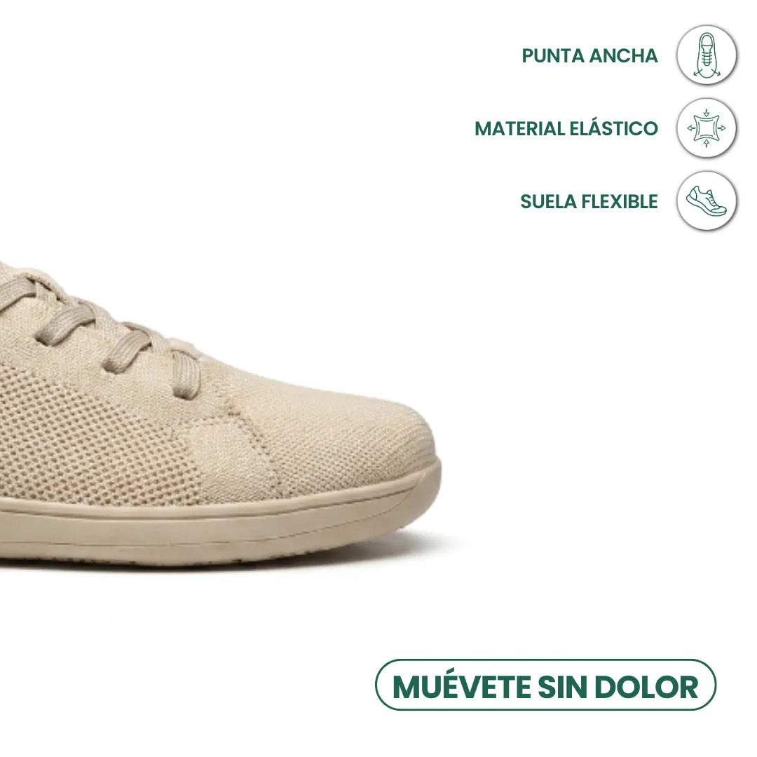 Detail van de brede neus van de beige sneaker met pictogrammen voor elastisch materiaal en flexibele zool. 5