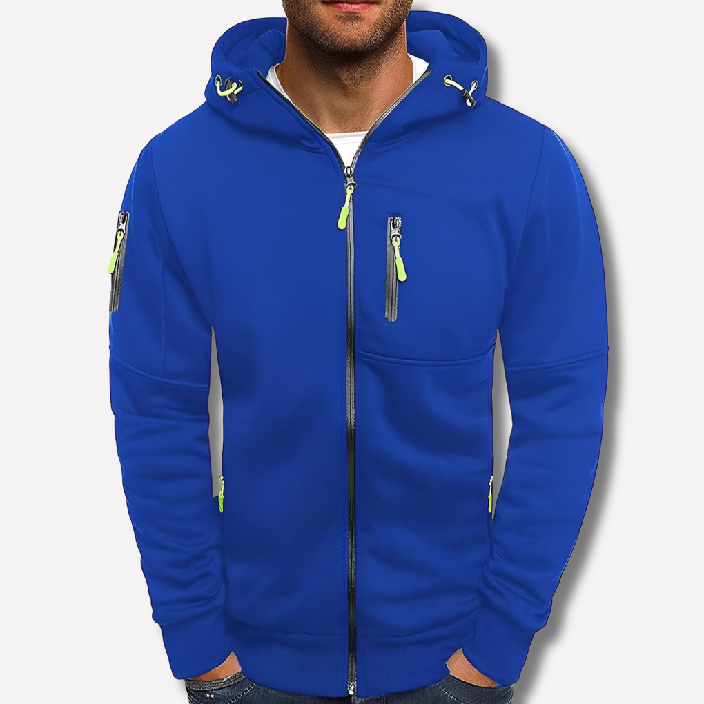 Kobaltblauwe hoodie met rits en neongroene ritstrekkers, voorkant gedragen door een model, tegen een neutrale lichte achtergrond. 2