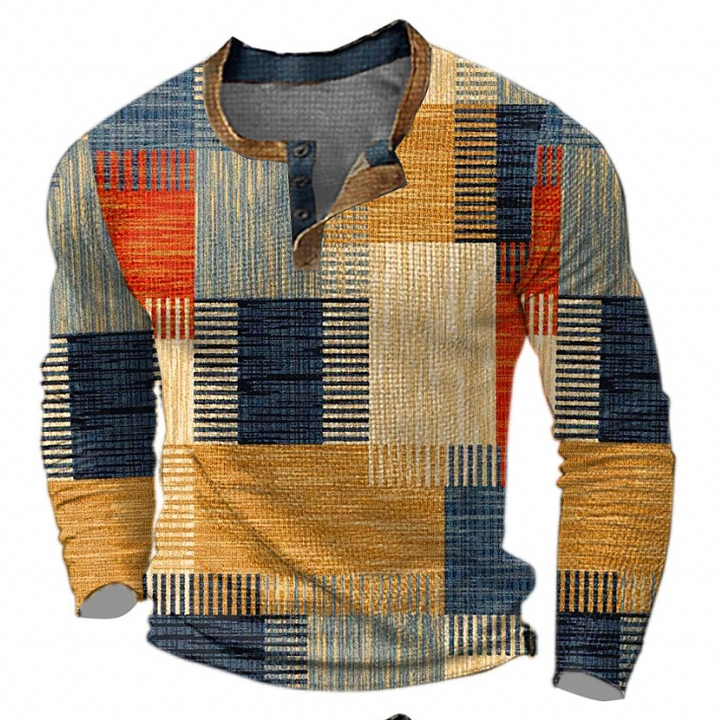 Voorkant van de trui met lange mouwen en knoopsluiting, blokprint in oranje, geel, beige en blauwtinten met bruine kraagrand. 1