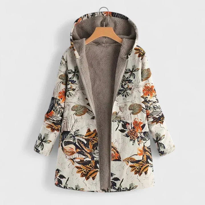 Open parka op hanger met oranje bloemen en bladeren op crèmekleurige stof, bruine teddyvoering zichtbaar 1