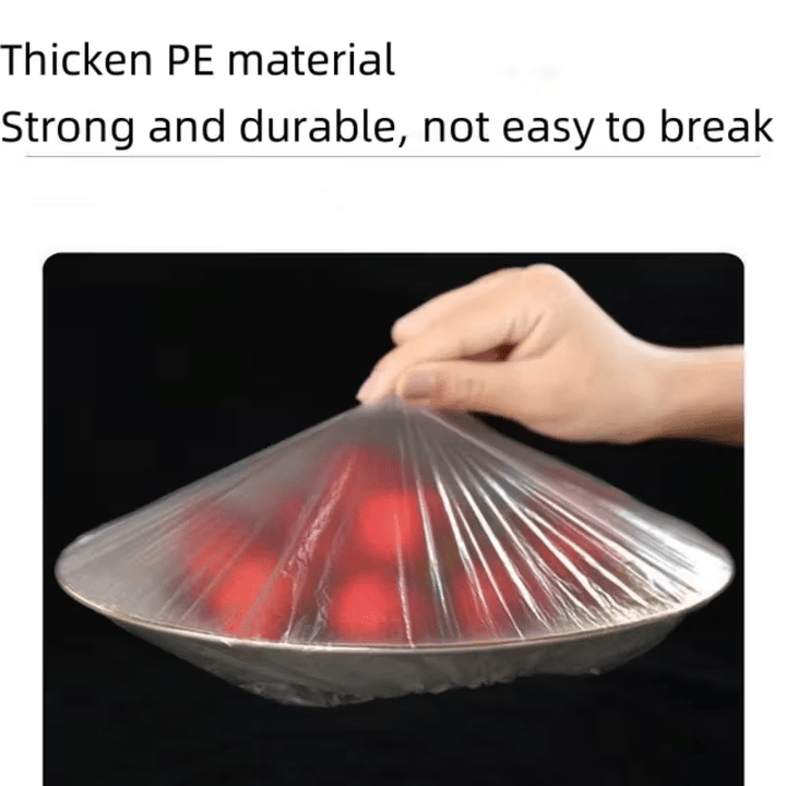 Een hand tilt een strak gespannen doorzichtige kap op een bord met rode tomaten, als voorbeeld van sterk en stevig plastic. 6