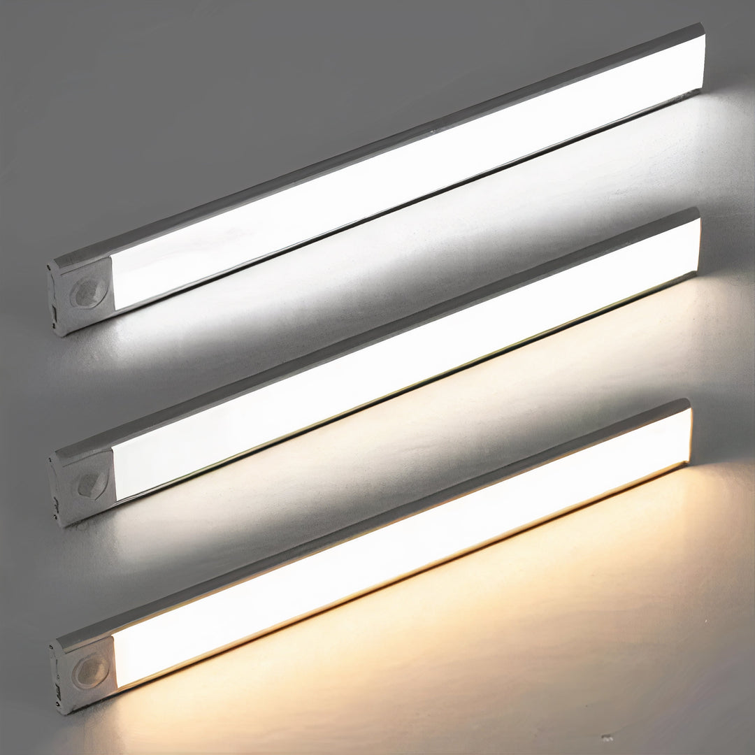 Drie ledlampen boven elkaar die drie lichtkleuren tonen, van koel wit tot warm wit, tegen een grijze achtergrond. 6
