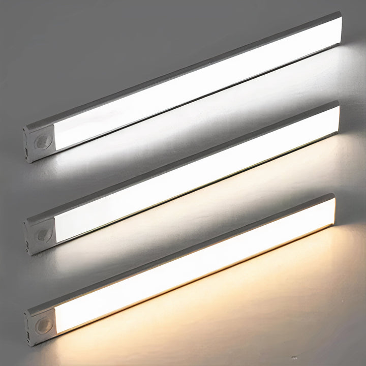 Drie ledlampen boven elkaar die drie lichtkleuren tonen, van koel wit tot warm wit, tegen een grijze achtergrond. 6