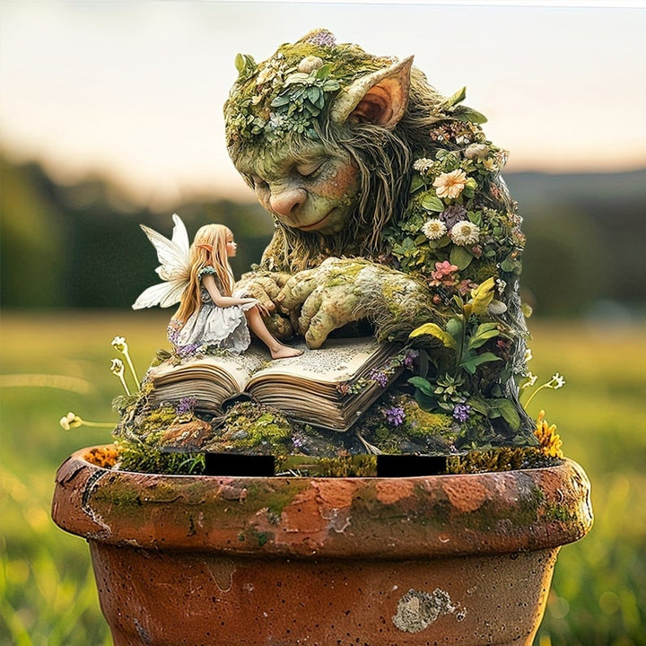 Slapende mosreus met een fee op een open boek, geplaatst in een verweerde terracotta pot met uitzicht op weiland. 11
