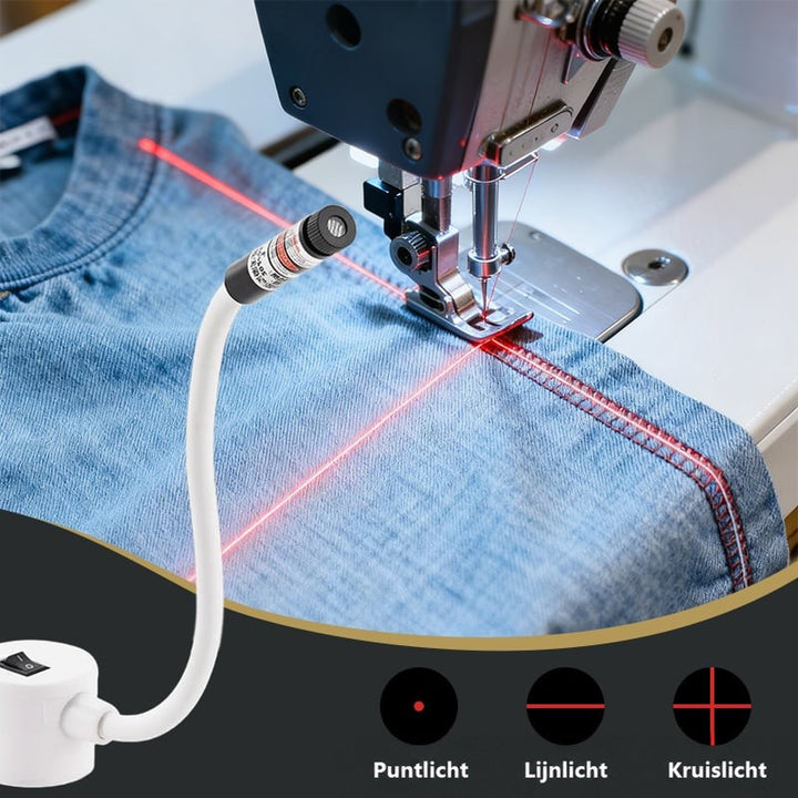 Laser op buigzame witte arm projecteert rode lijnen naast de naald op denim stof 1