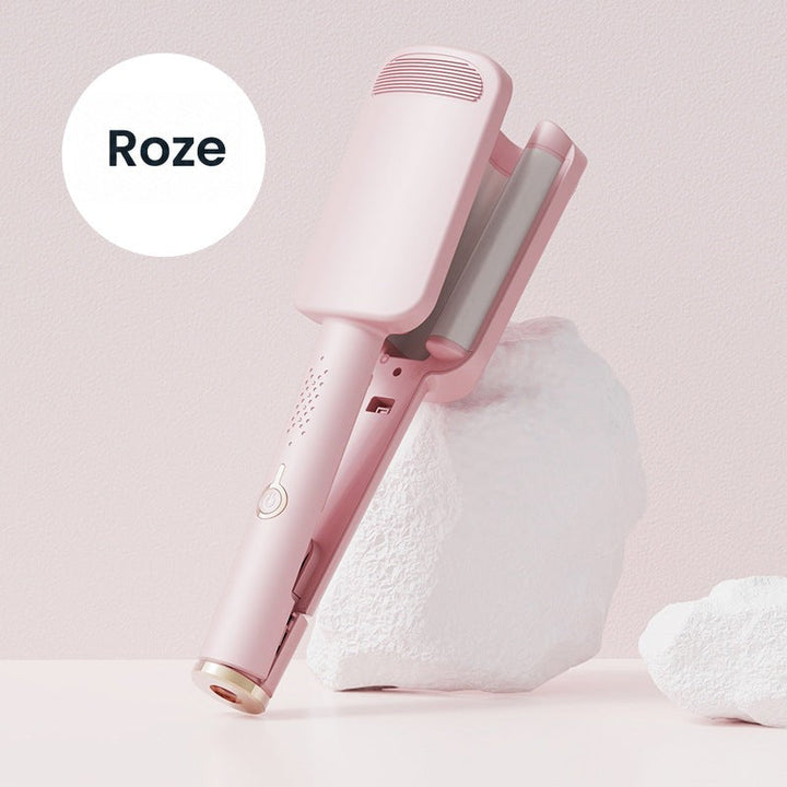 Roze golfijzer schuin tegen een wit decorblok, met de golvende verwarmingsplaten in beeld 9