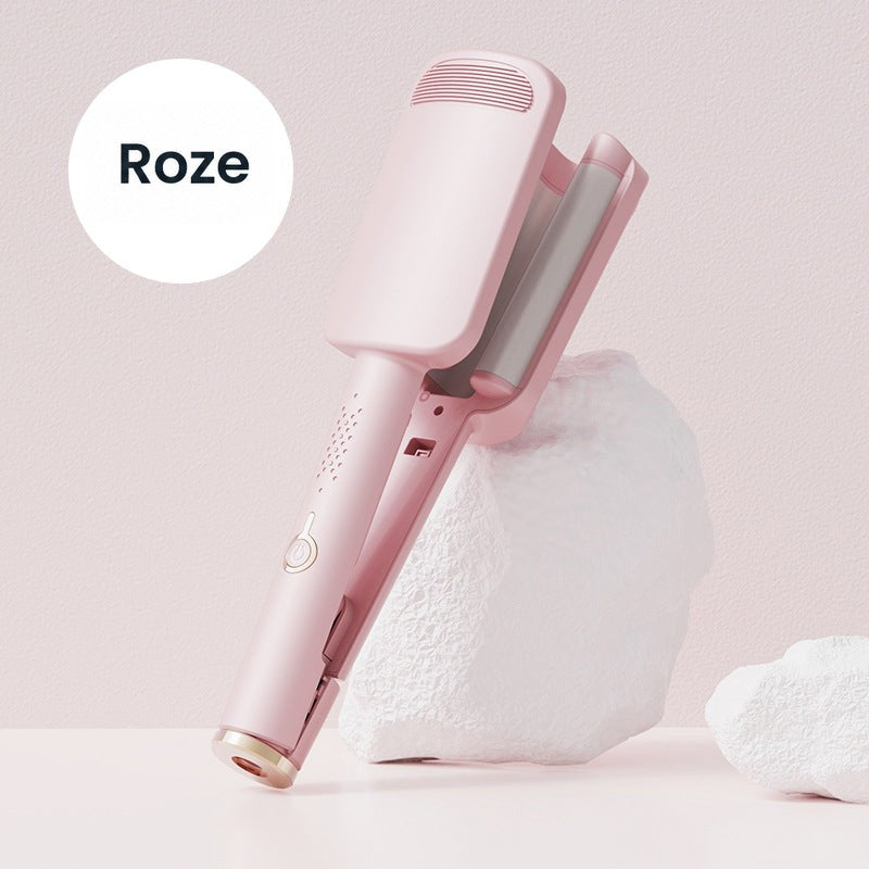 Roze golfijzer rechtopstaand tegen een wit rotsachtig blok, met de golvende platen zichtbaar 3