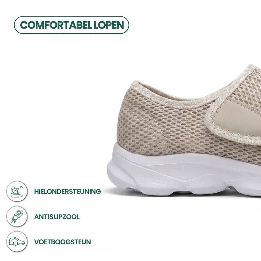 Beige mesh wandelschoen met witte zool en klittenband, detail van de hiel met pictogrammen voor hielsteun, antislipzool en voetboogsteun. 31