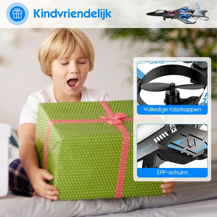Verrast jongetje houdt een groen cadeaupakket met roze strik vast, met twee detailbeelden van rotorbeschermers en schuimmateriaal. 5