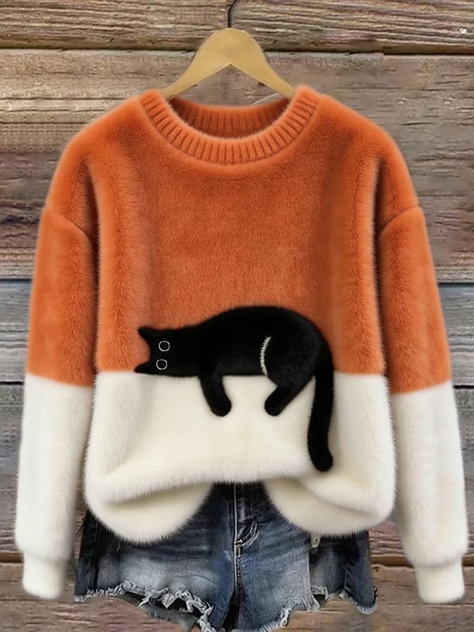 Oranje pluchen trui met witte onderkant en mouwen, zwarte kat op de voorkant, aan hanger 3