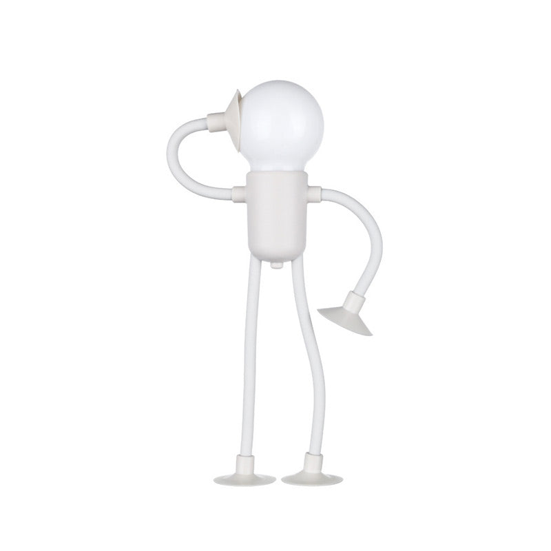 Wit mannetjeslampje met een bolle lamp als hoofd, buigbare armen en benen met zuignappen, een hand tegen het hoofd gebogen. 2